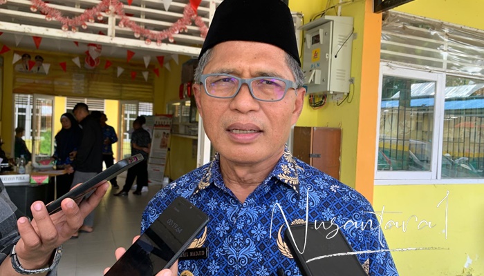 Pj. Wali Kota Gorontalo, Ismail Madjid saat diwawancarai, Senin (17/2) usai menghadiri Musrenbangda tingkat Kecamatan Kota Barat, Kota Gorontalo. [foto:fikar/nusantara1]
