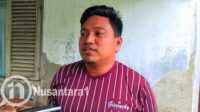 Sandra Jafar Biu Kepala Desa Tolotio saat diwawancarai awak media. [foto:juna/nusantara1]