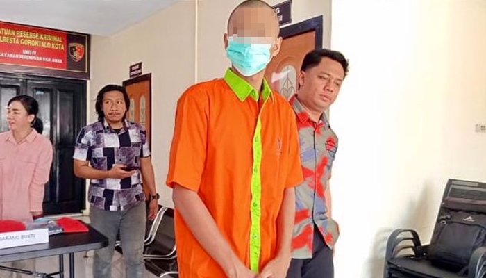 Pelaku saat digiring ke Mapolres Gorontalo Kota [foto:dok]