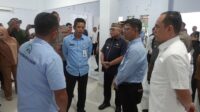 Ketua DPRD Kabupaten Gorontalo, Zulfikar Usira (kemeja putih) saat menghadiri peresmian SPPG di Desa Pilohayanga, Kecamatan Telaga, Selasa 6 Januari 2026 [foto:dok/humas]